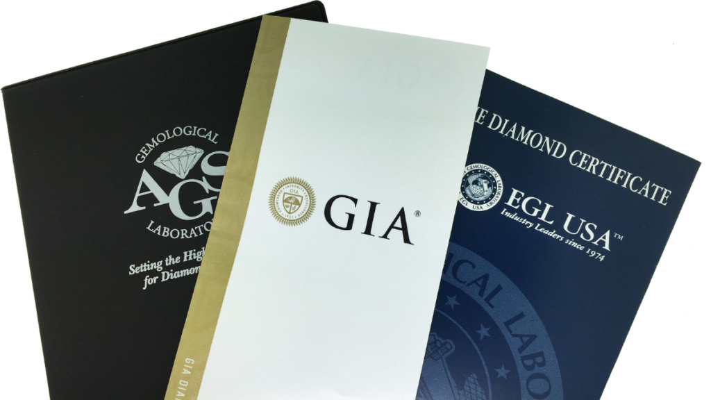 Macro photograph comparing GIA, AGS, and EGL USA diamond grading certifications, highlighting different lab standards for resale value.